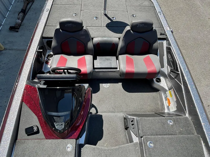 Slide: The Image of 2019 Skeeter ZX 250 boat interior with dual seats and steering console. - 8