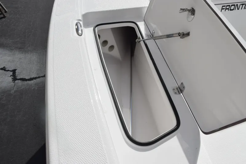 Slide: The Image of Open storage compartment on 2025 Frontier 2104 boat deck. - 13