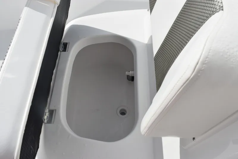 Slide: The Image of Open storage compartment in a 2025 Frontier 2104 boat. - 14