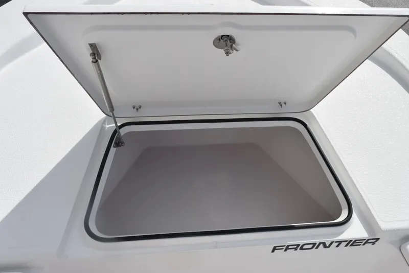Slide: The Image of Open storage compartment on a 2025 Frontier 2104 boat. - 15