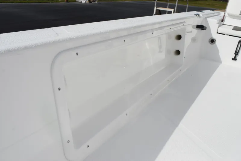 Slide: The Image of 2025 Frontier 2104 boat interior detail, showcasing sleek white design and storage compartment. - 17