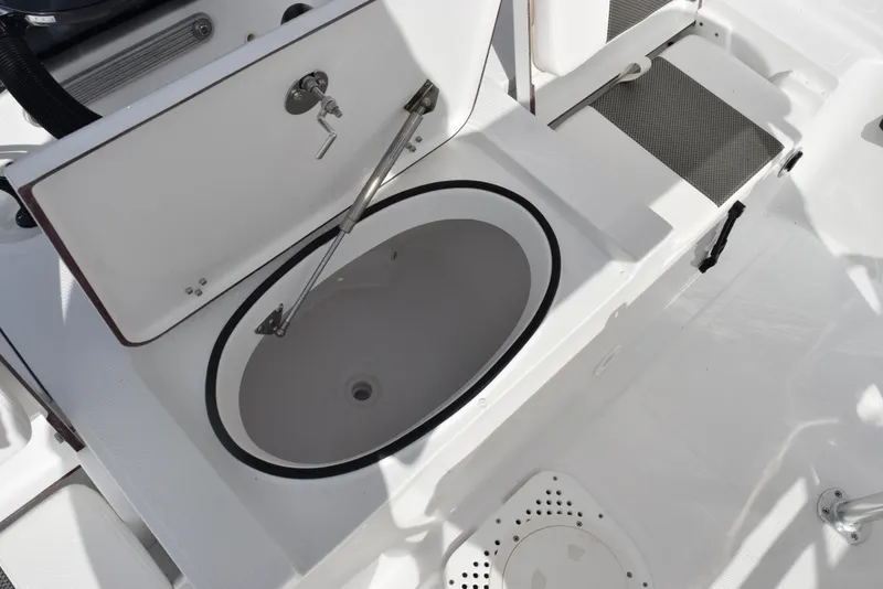 Slide: The Image of Open storage compartment on 2025 Frontier 2104 boat deck. - 18