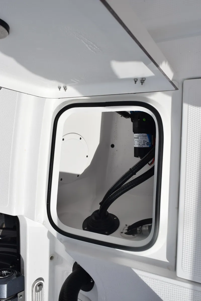 Slide: The Image of 2025 Frontier 2104 boat interior compartment with wiring and equipment. - 22