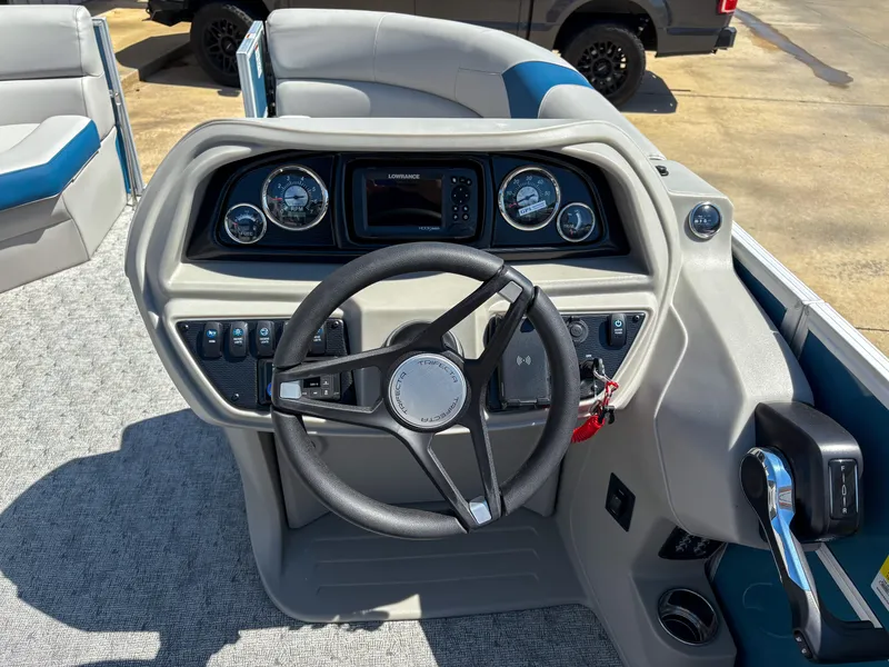 Slide: The Image of Steering console of 2025 Trifecta 22 RF LE boat with modern controls and dashboard. - 13