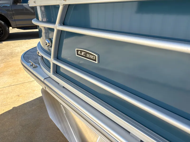 Slide: The Image of 2025 Trifecta 22 RF LE boat, blue exterior, LE Series badge, close-up view. - 5