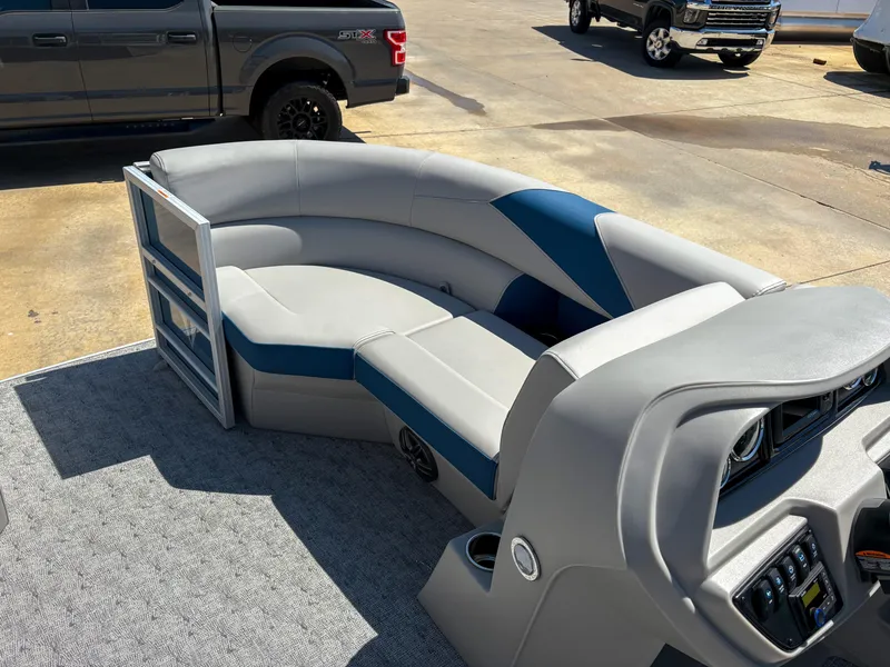 Slide: The Image of 2025 Trifecta 22 RF LE pontoon boat interior with gray and blue seating. - 8