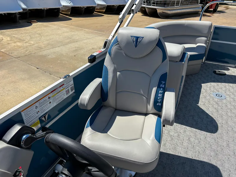 Slide: The Image of Captain's chair on 2025 Trifecta 22 RF LE pontoon boat, featuring sleek design and comfortable seating. - 9