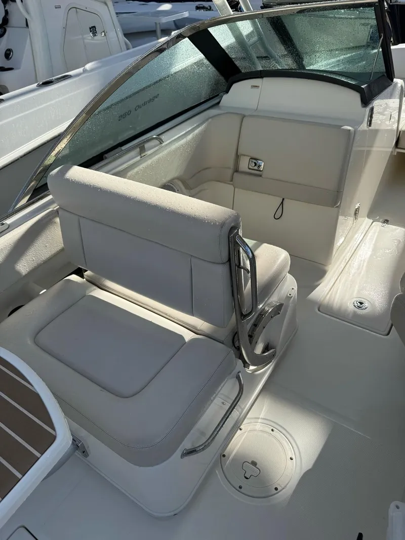 Slide: The Image of 2020 Boston Whaler 230 Vantage boat interior with cushioned seating and sleek design. - 7