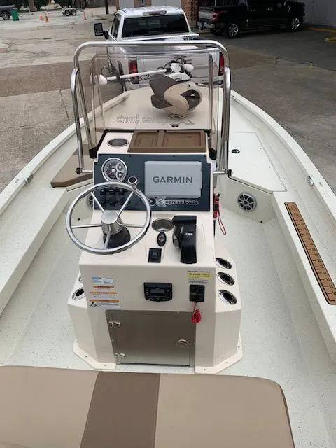 Slide: The Image of 2024 Xpress H22 boat interior with Garmin navigation system and steering console. - 6