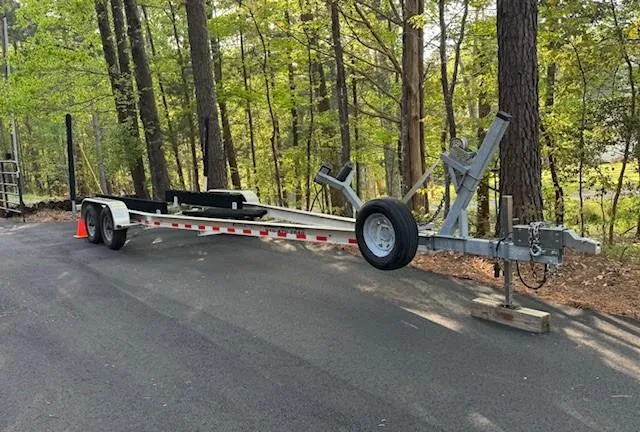 Slide: The Image of Trailer for 2022 Chaparral 267 SSX OB in wooded area. - 12