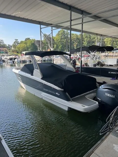 Slide: The Image of 2022 Chaparral 267 SSX OB boat docked with Yamaha outboard engine. - 13
