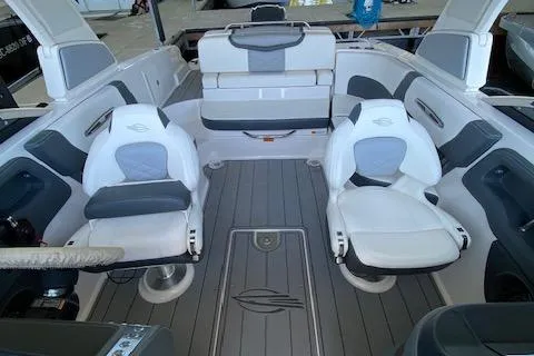 Slide: The Image of 2022 Chaparral 267 SSX OB boat interior with white and gray seating. - 18