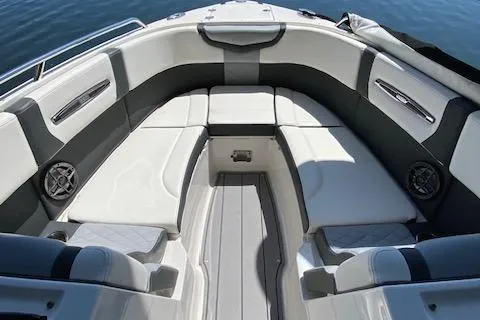 Slide: The Image of 2022 Chaparral 267 SSX OB boat interior with cushioned seating and sleek design. - 19