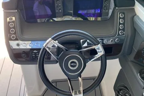 Slide: The Image of Steering wheel and dashboard of 2022 Chaparral 267 SSX OB boat. - 21
