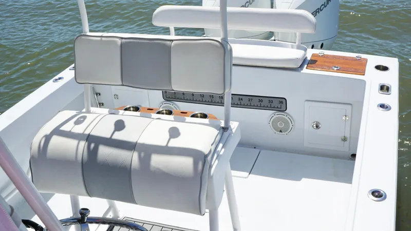Slide: The Image of 2000 Regulator 26 Classic boat interior with seating and fishing rod holders. - 15