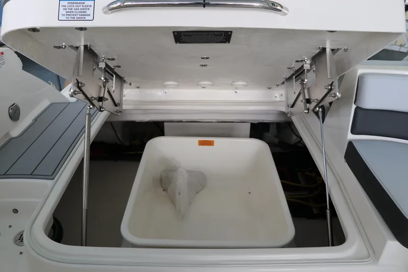 Slide: The Image of Open storage compartment on 2025 Chaparral 280 OSX boat, showcasing interior details. - 11