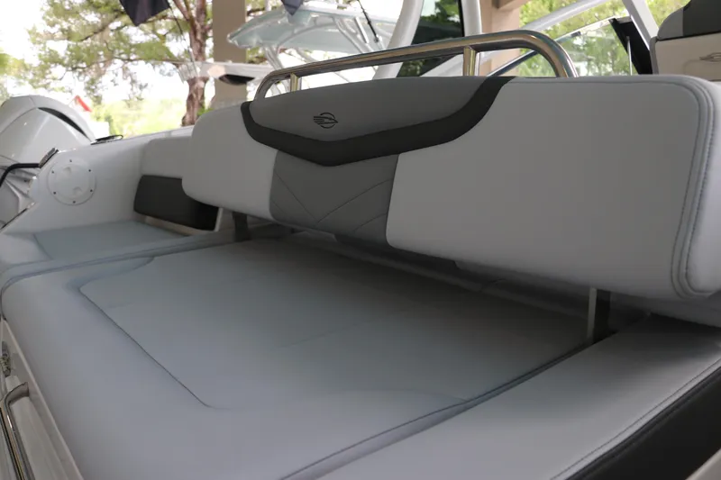 Slide: The Image of 2025 Chaparral 280 OSX boat interior with sleek, modern seating design. - 12