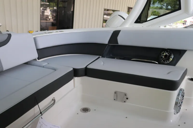 Slide: The Image of 2025 Chaparral 280 OSX boat interior with sleek seating and modern design. - 14