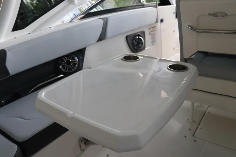 Slide: The Image of Interior of 2025 Chaparral 280 OSX boat with table and cup holders. - 19