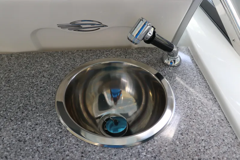 Slide: The Image of Stainless steel sink and faucet on Chaparral 280 OSX 2025 boat. - 26