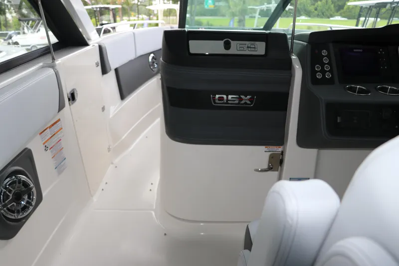 Slide: The Image of Interior of 2025 Chaparral 280 OSX boat, featuring sleek design and modern controls. - 32