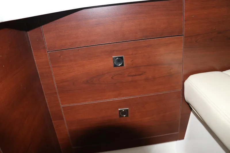 Slide: The Image of Wooden cabinetry in the 2025 Chaparral 280 OSX boat interior. - 37