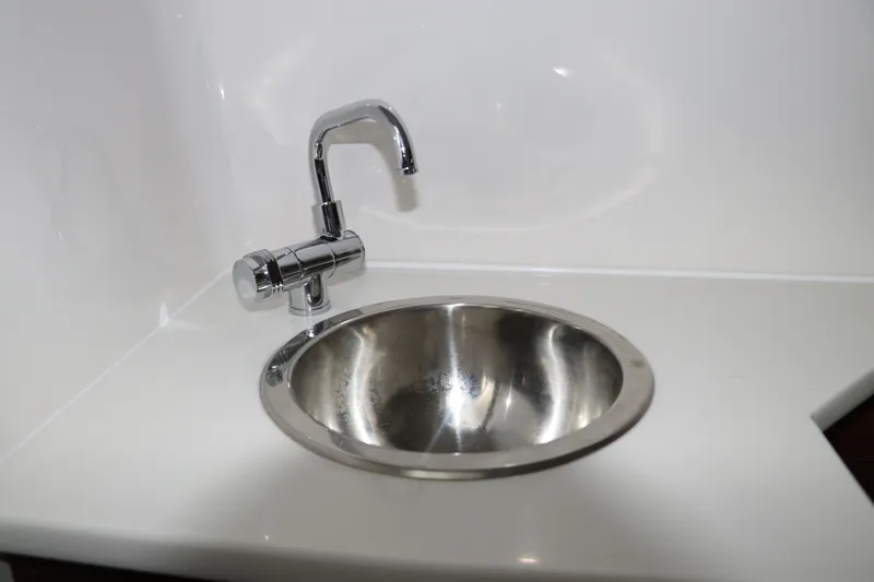 Slide: The Image of Stainless steel sink and chrome faucet in 2025 Chaparral 280 OSX boat. - 38