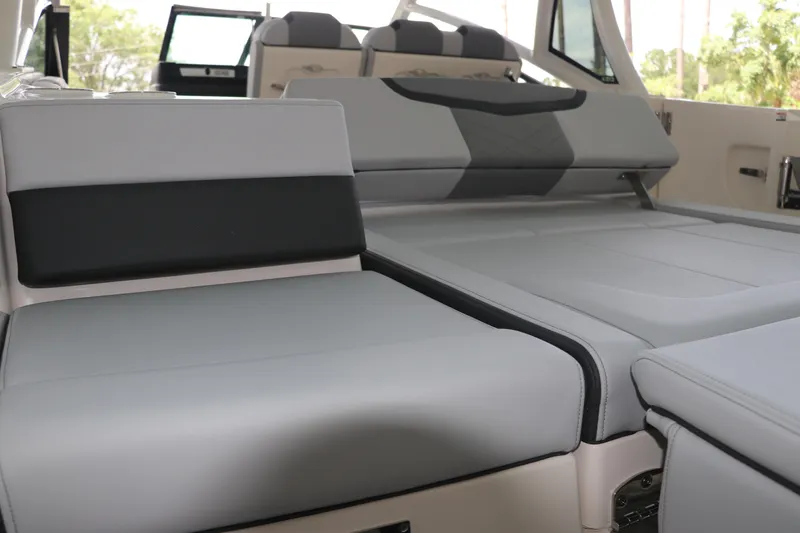 Slide: The Image of 2025 Chaparral 280 OSX boat interior with luxurious gray seating and modern design. - 47