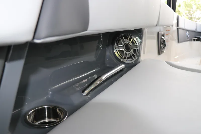 Slide: The Image of 2025 Chaparral 280 OSX boat interior with speaker and cup holder. - 49
