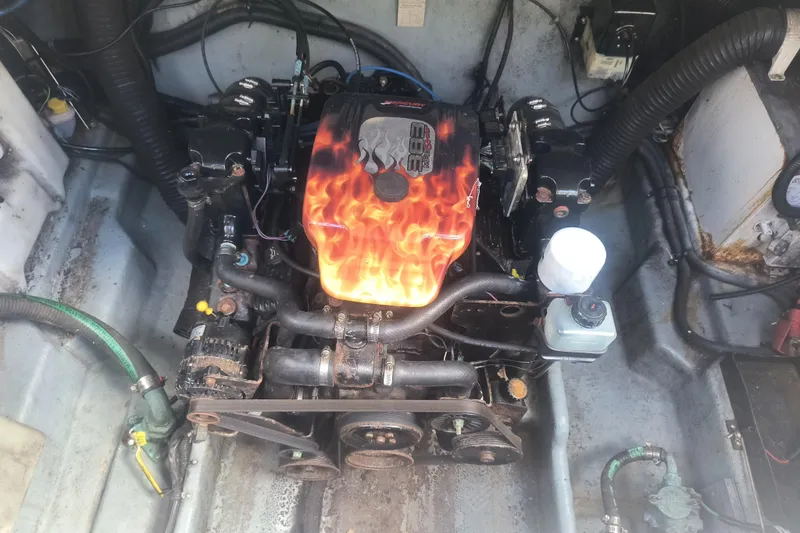 Slide: The Image of Engine compartment of a 2000 Sea Ray 270 Sundancer with custom flame-painted cover. - 16