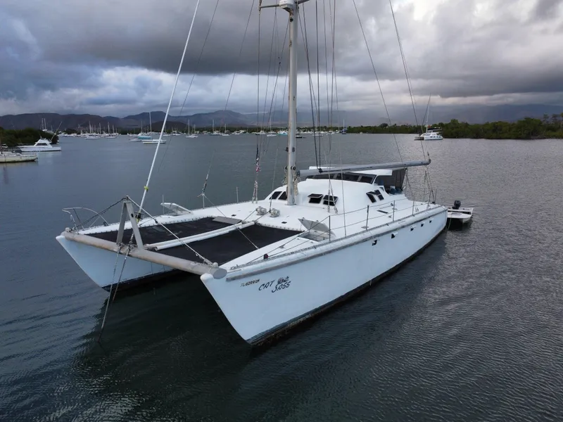 The Image of 1972 Custom 53 Catamaran sailing on calm waters under cloudy skies. - 0