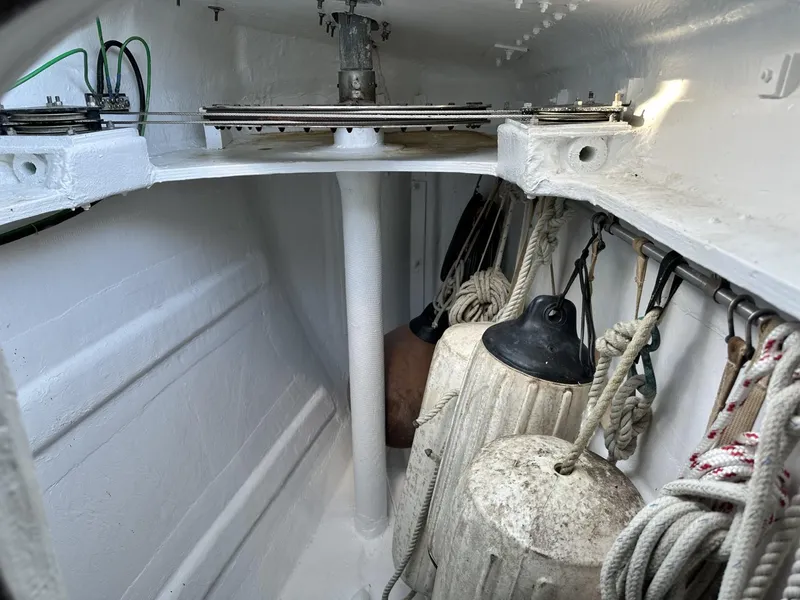 Slide: The Image of Interior of a 1972 Custom 53 Catamaran with ropes and fenders stored neatly. - 33