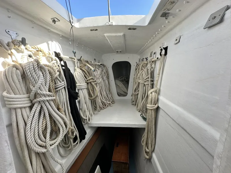 Slide: The Image of Interior of a 1972 Custom 53 Catamaran with neatly coiled ropes. - 34