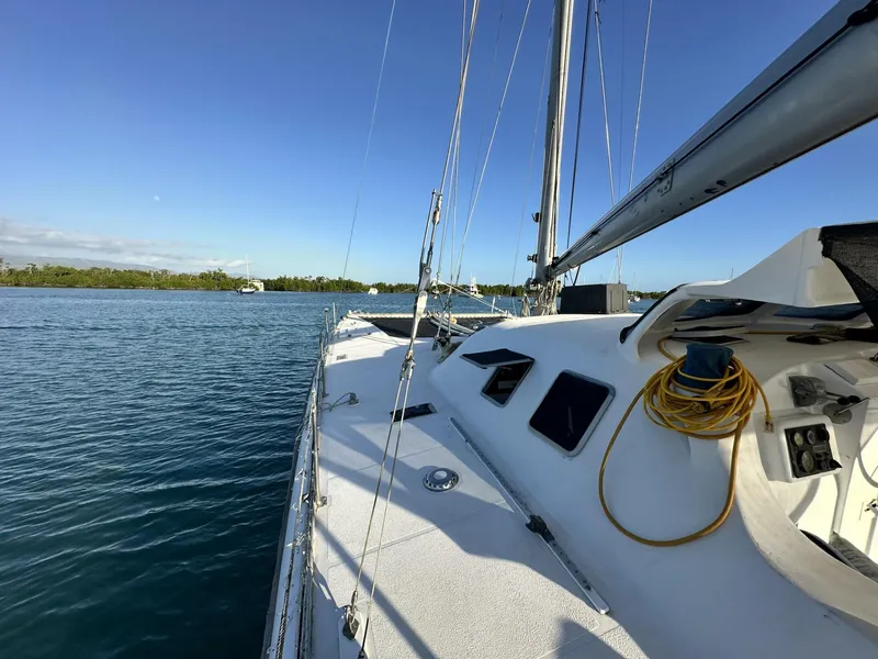 Slide: The Image of 1972 Custom 53 Catamaran sailing on calm waters under clear blue skies. - 39
