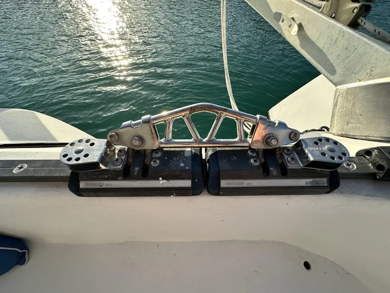Slide: The Image of Stainless steel fittings on a 1972 Custom 53 Catamaran, with water in the background. - 45