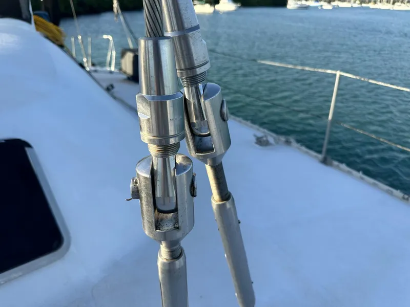 Slide: The Image of Close-up of rigging hardware on a 1972 Custom 53 Catamaran, with ocean in the background. - 47