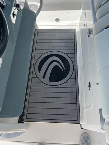 Slide: The Image of 2024 Edgewater 340CC boat deck with logo, featuring sleek design and modern aesthetics. - 17