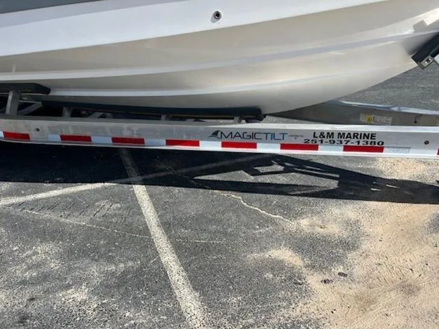 Slide: The Image of 2024 Edgewater 340CC boat on Magic Tilt trailer at L&M Marine dealership. - 25