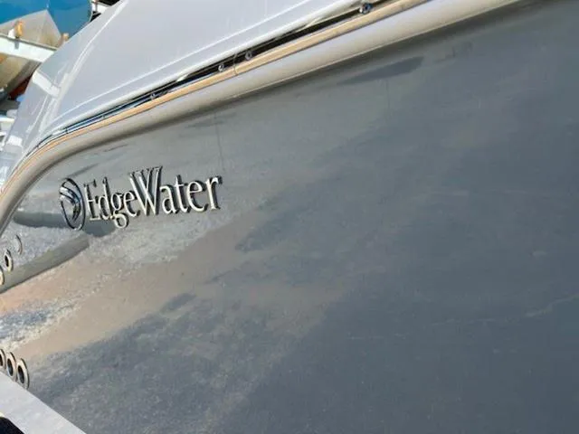 Slide: The Image of Edgewater 340CC 2024 boat hull with logo, sleek design. - 27