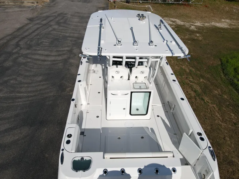 Slide: The Image of 2024 Edgewater 340CC boat, aerial view of spacious deck and seating area. - 4