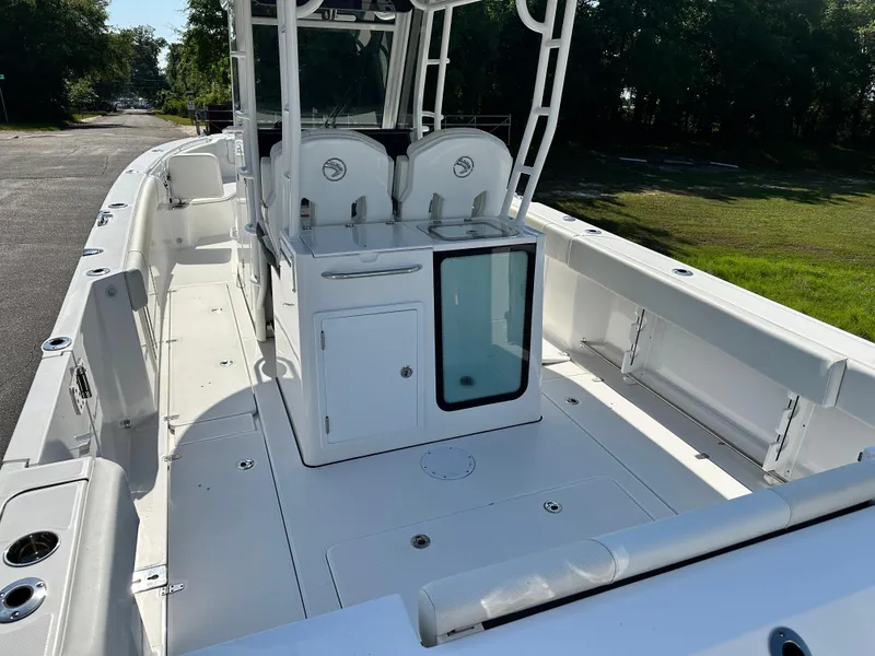 Slide: The Image of 2024 Edgewater 340CC boat interior with spacious deck and seating. - 5