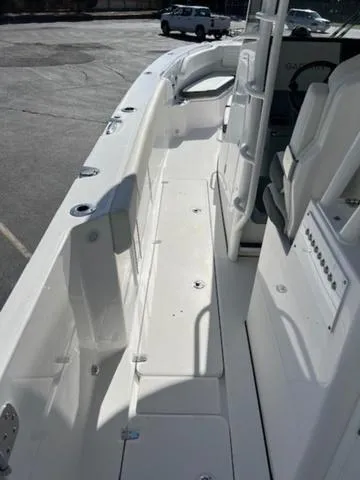 Slide: The Image of 2024 Edgewater 340CC boat interior, showcasing sleek white seating and modern design. - 7