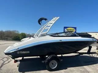Slide: The Image of 2025 Yamaha Boats 195S on trailer, sleek design, blue and white color scheme. - 2