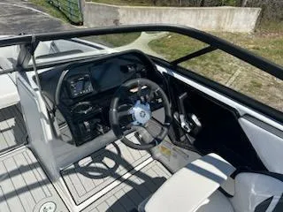 Slide: The Image of 2025 Yamaha Boats 195S interior, featuring sleek steering and modern dashboard design. - 5