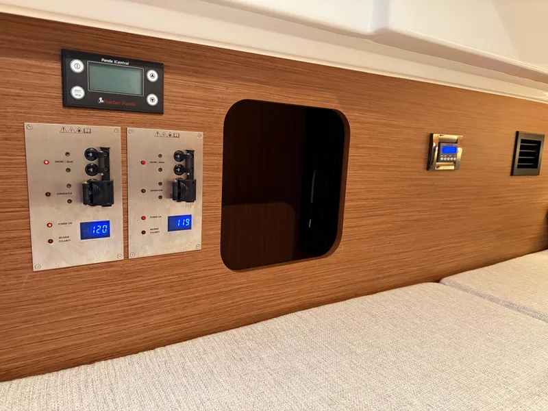 Slide: The Image of Control panel and interior of 2022 Jeanneau NC 1095 Coupe boat cabin. - 31