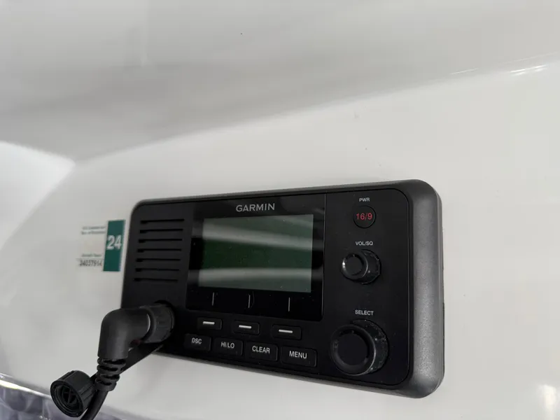 Slide: The Image of Garmin marine radio on 2022 Jeanneau NC 1095 Coupe boat dashboard. - 32