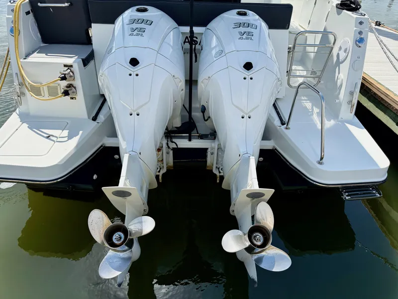Slide: The Image of Twin 300 HP outboard engines on 2022 Jeanneau NC 1095 Coupe boat. - 4