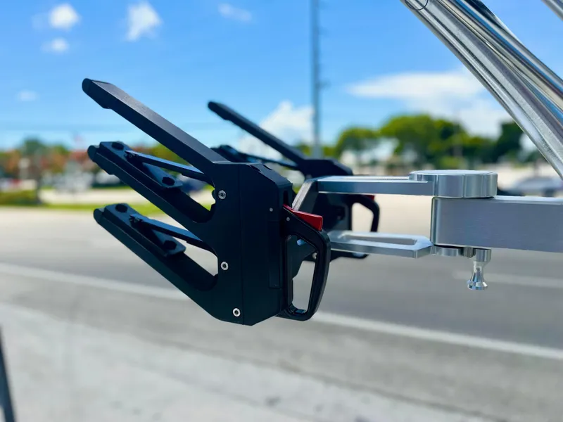 Slide: The Image of 2023 MasterCraft NXT24 boat accessory, close-up of wakeboard rack against a clear sky. - 10