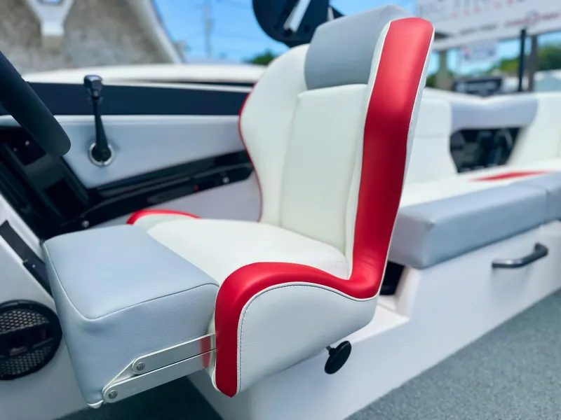 Slide: The Image of 2023 MasterCraft NXT24 boat interior with red and white seating. - 22