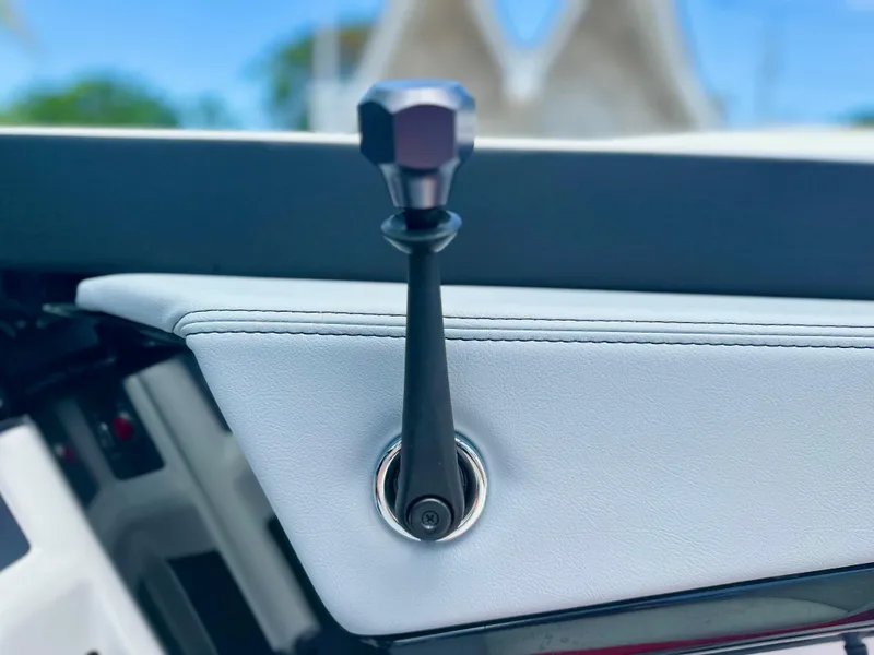 Slide: The Image of 2023 MasterCraft NXT24 boat interior detail with sleek control lever. - 23